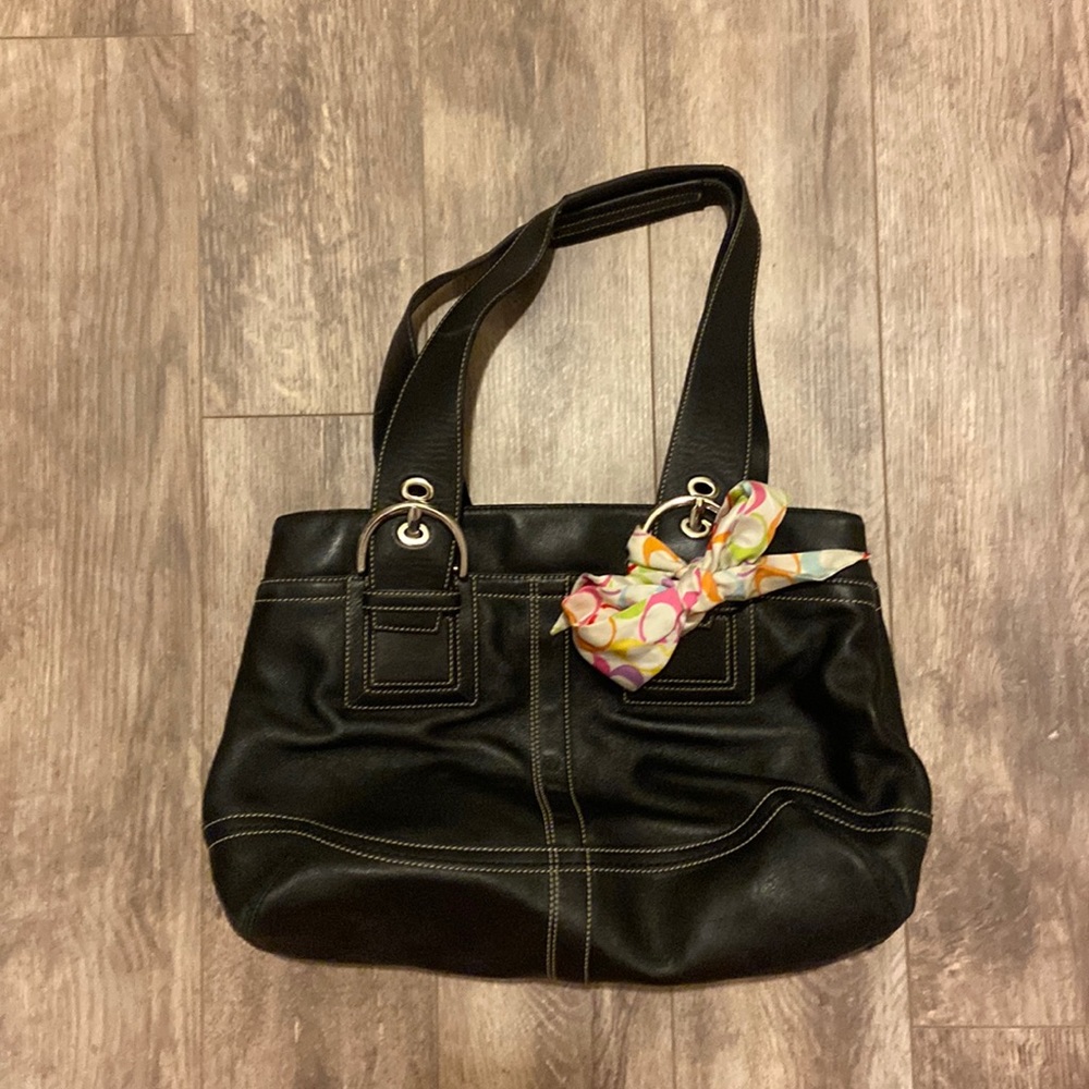 Coach black leather bag used. Some staines on the inside compartments.
